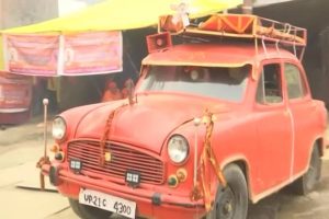 Ambassador Baba arrives at the Maha Kumbh Mela in his saffron colored car